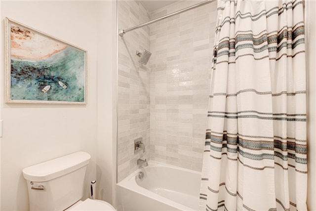 bathroom featuring shower / bath combo with shower curtain and toilet