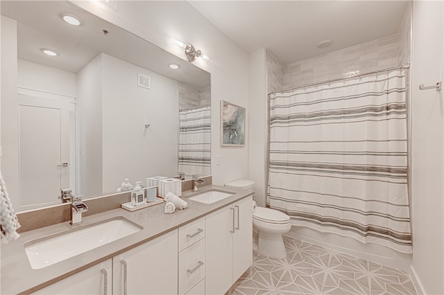 full bathroom featuring tile patterned flooring, vanity, toilet, and shower / tub combo with curtain