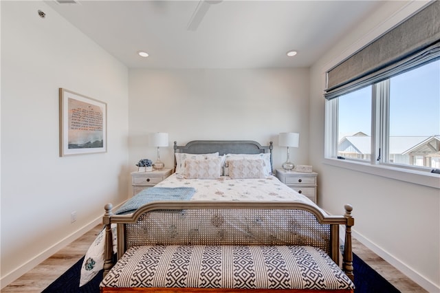 bedroom with light wood-type flooring and ceiling fan