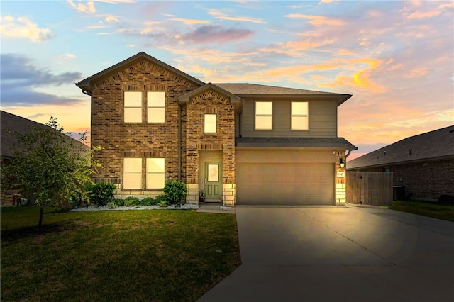1345 Regents Park, Corpus Christi, TX 78415 - traditional home with concrete driveway, a garage, brick siding, and central air condition unit