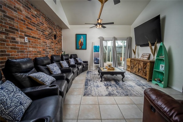 1703 Bayshores, Rockport, TX 78382 - living area featuring light tile patterned floors, lofted ceiling, ceiling fan, brick wall, and baseboards