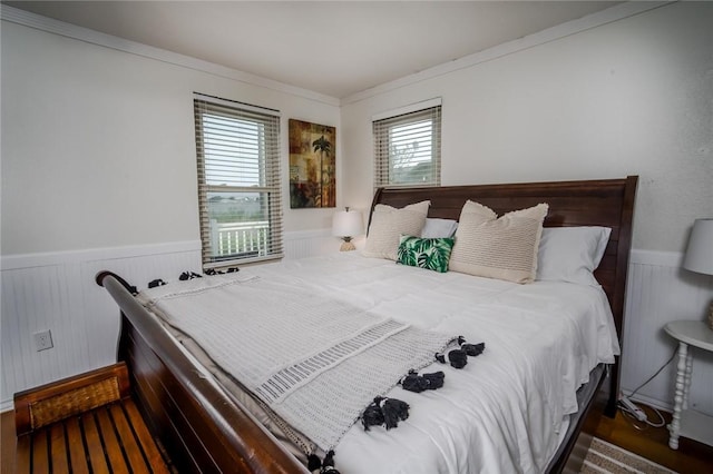 1703 Bayshores, Rockport, TX 78382 - bedroom featuring a wainscoted wall and crown molding