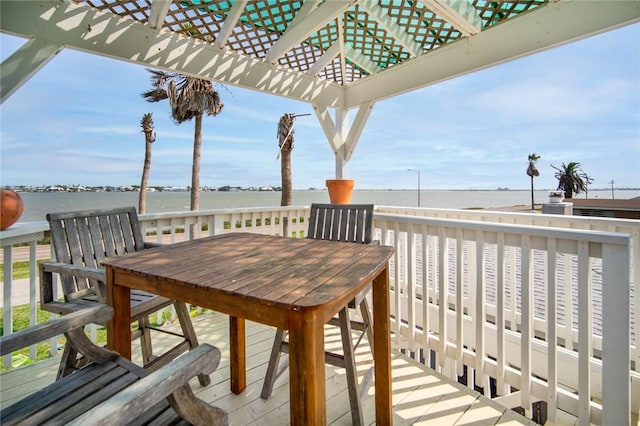 1703 Bayshores, Rockport, TX 78382 - deck with a water view, a pergola, and outdoor dining area