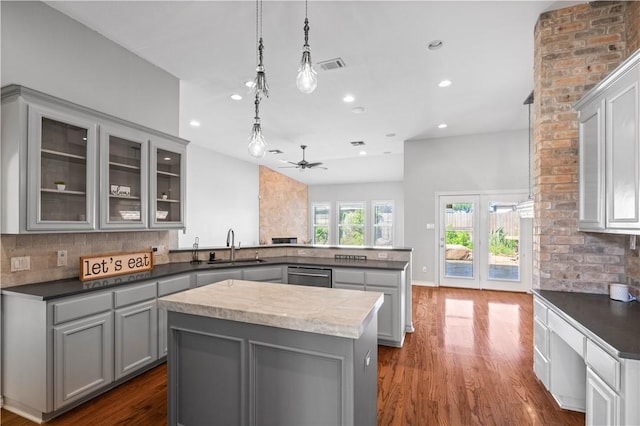 108 Black Diamond, Portland, TX 78374 - kitchen featuring gray cabinets, a peninsula, dishwasher, backsplash, and recessed lighting