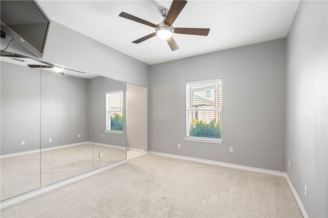 108 Black Diamond, Portland, TX 78374 - spare room featuring plenty of natural light, a ceiling fan, and carpet flooring