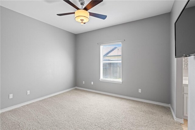108 Black Diamond, Portland, TX 78374 - empty room featuring light colored carpet, baseboards, and a ceiling fan