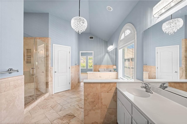 108 Black Diamond, Portland, TX 78374 - full bathroom with a chandelier, a stall shower, vanity, and high vaulted ceiling