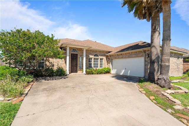 108 Black Diamond, Portland, TX 78374 - ranch-style house with driveway, an attached garage, brick siding, and roof with shingles