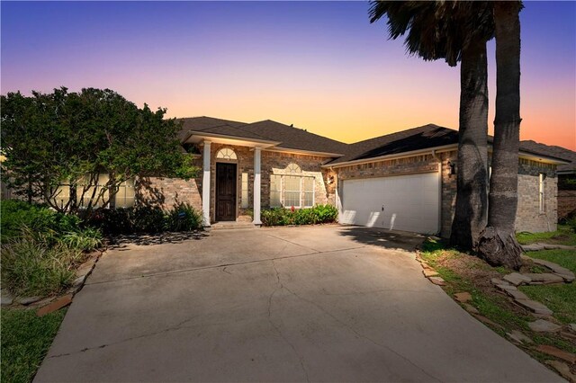 108 Black Diamond, Portland, TX 78374 - ranch-style home with concrete driveway, a garage, and brick siding