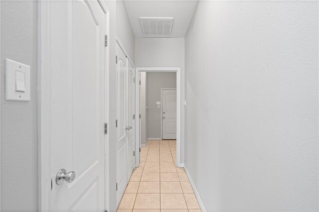 108 Black Diamond, Portland, TX 78374 - hallway featuring light tile patterned floors and baseboards