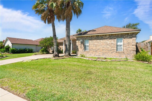 108 Black Diamond, Portland, TX 78374 - ranch-style home featuring brick siding, concrete driveway, and roof with shingles
