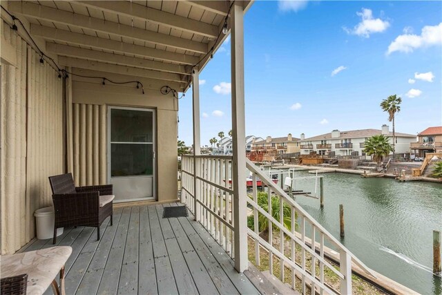 14300 S Padre Island Dr Unit 207, Corpus Christi, TX 78418 - balcony with a water view, a residential view, and a dock
