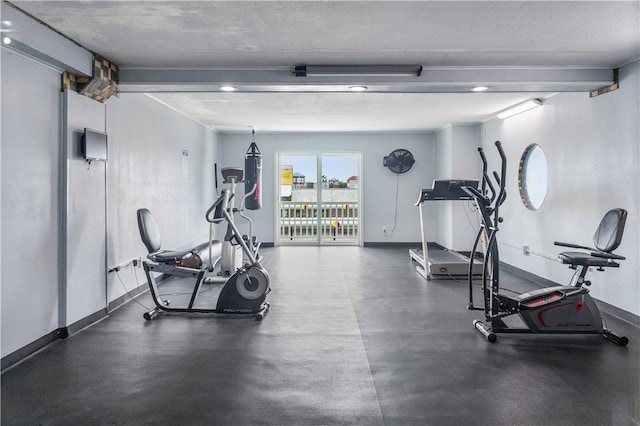 workout area with a textured ceiling