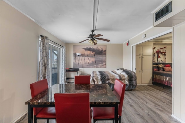 dining area featuring ornamental molding, hardwood / wood-style floors, and ceiling fan