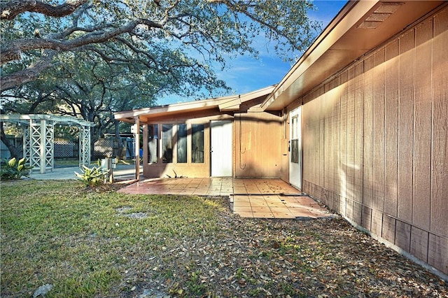 exterior space with a yard, a pergola, and a patio area