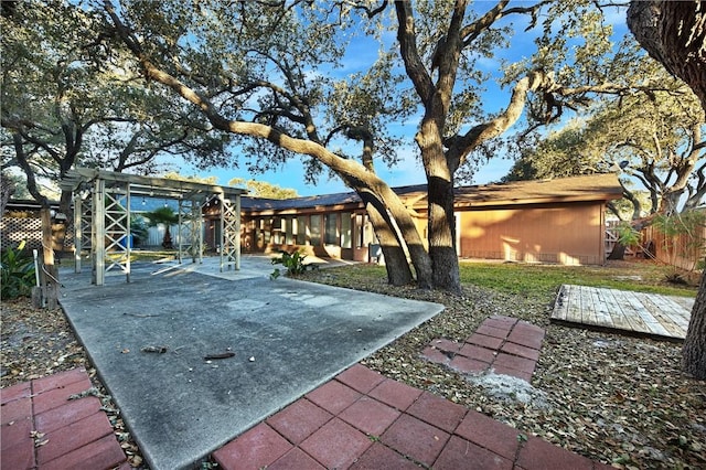 exterior space featuring a patio area and a pergola