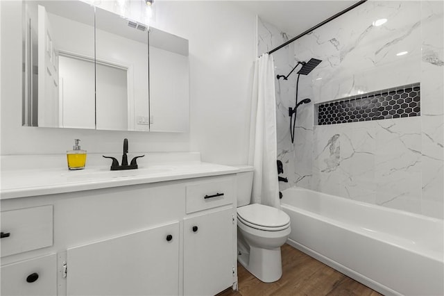 full bathroom featuring shower / bath combo, toilet, wood-type flooring, and vanity