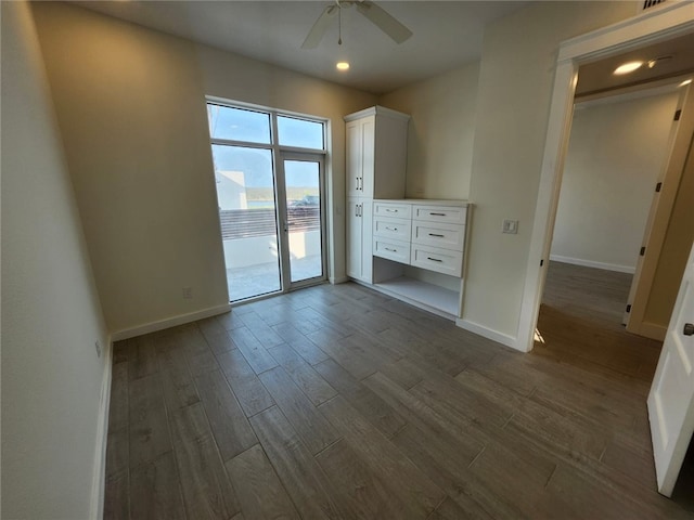 interior space with dark wood finished floors, baseboards, ceiling fan, and recessed lighting
