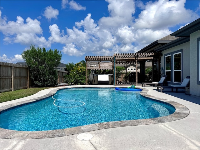 view of swimming pool with a patio area and a pergola