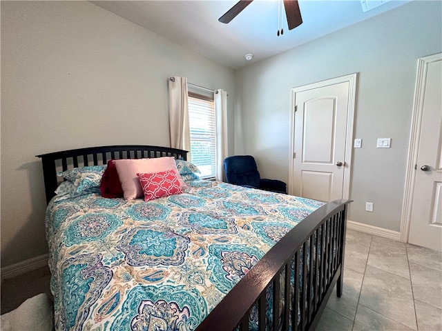 tiled bedroom with ceiling fan