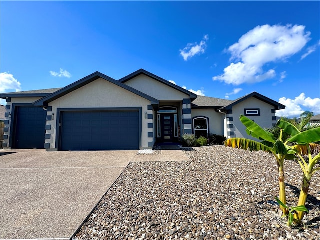 ranch-style house featuring a garage