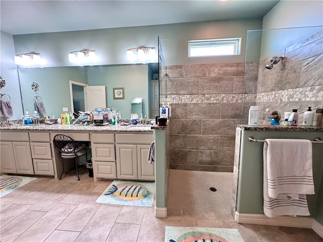 bathroom with walk in shower and vanity