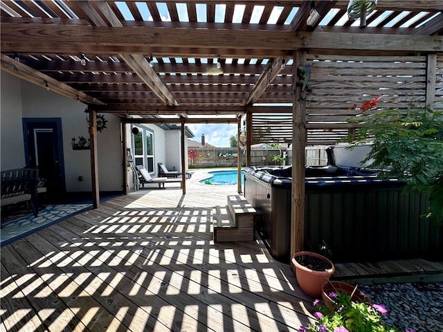 view of patio featuring a pergola and a swimming pool with hot tub