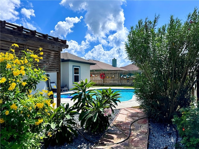 view of pool with a pergola