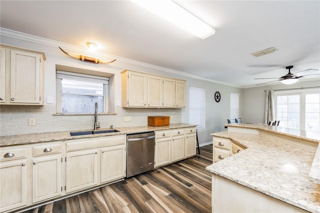 kitchen with sink, dishwasher, plenty of natural light, and crown molding