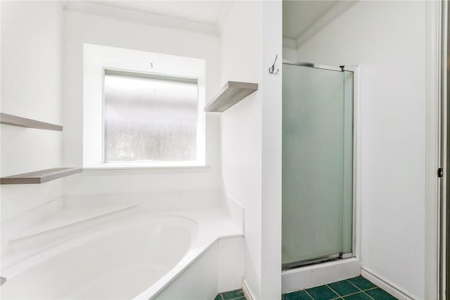 bathroom with separate shower and tub, crown molding, and tile patterned floors