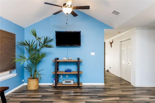 living room featuring ceiling fan, lofted ceiling, and dark wood-type flooring