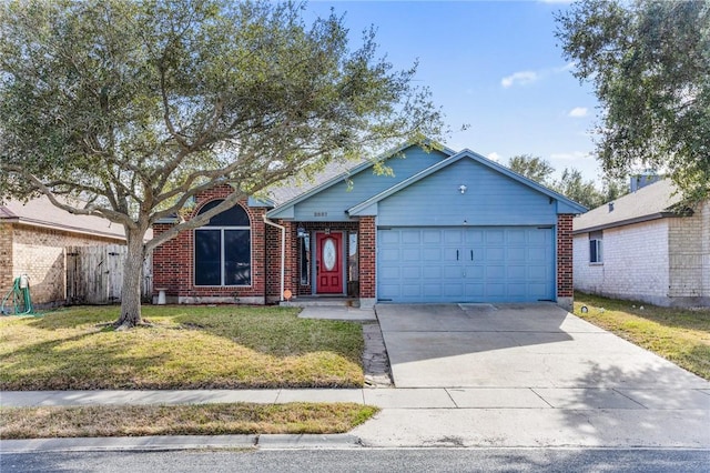 view of front of property featuring a garage and a front yard