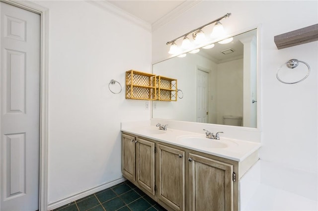 bathroom featuring ornamental molding, toilet, vanity, and tile patterned flooring