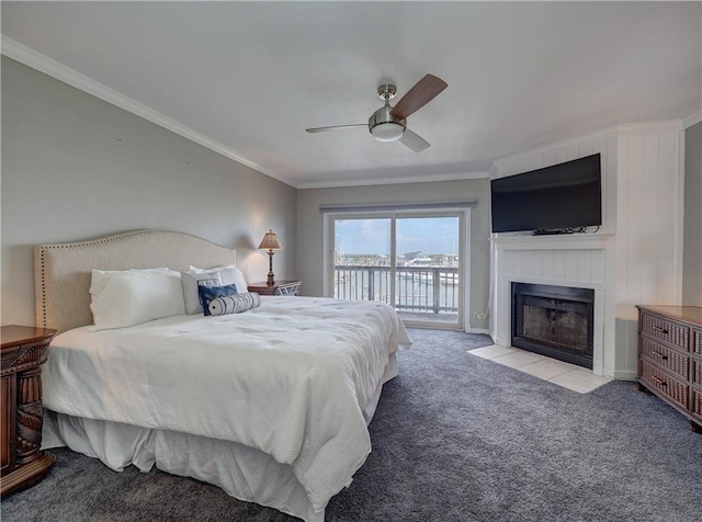 200 W Cotter Ave Unit C3, Port Aransas, TX 78373 - bedroom featuring access to exterior, carpet floors, a tiled fireplace, crown molding, and a ceiling fan