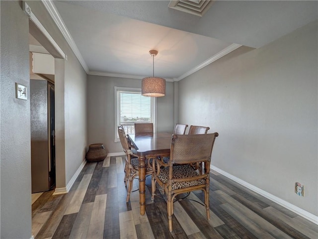 200 W Cotter Ave Unit C3, Port Aransas, TX 78373 - dining space featuring wood finished floors, baseboards, and ornamental molding