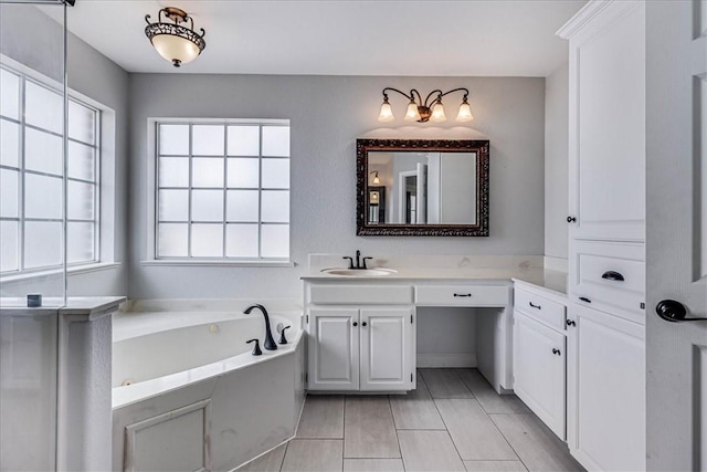 full bathroom with a garden tub, tile patterned flooring, and vanity