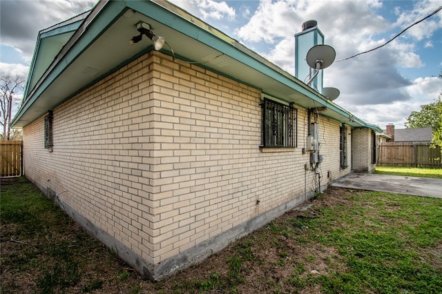 view of home's exterior with a patio area