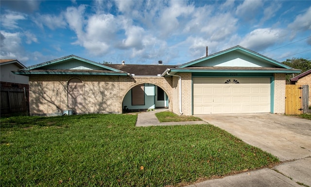 ranch-style home with a front lawn and a garage