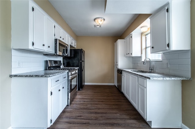 kitchen featuring white cabinets, stainless steel appliances, and sink