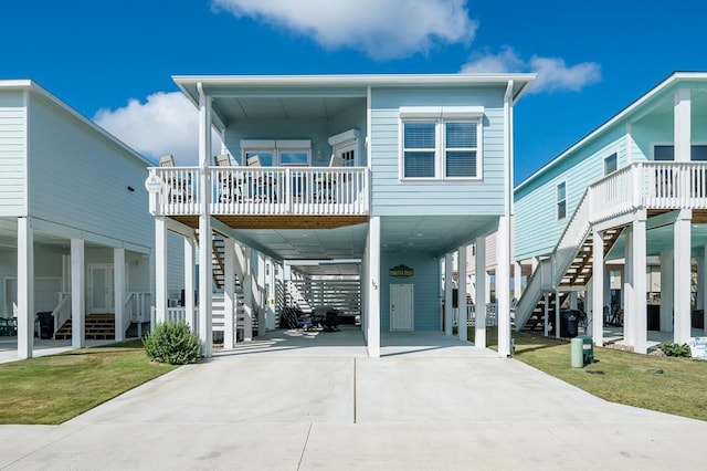 view of front of property with a front yard and a carport