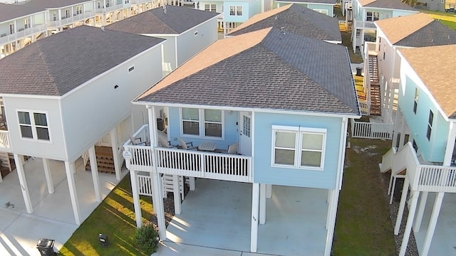 rear view of property featuring a carport