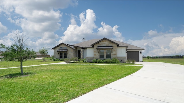 view of front facade with a front lawn and a garage