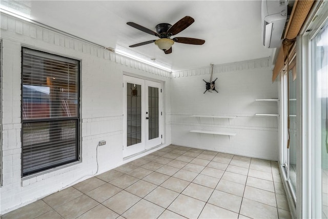 unfurnished sunroom with french doors and a wall mounted air conditioner