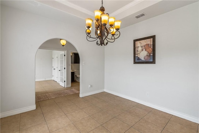 unfurnished room featuring light tile patterned flooring, a notable chandelier, arched walkways, baseboards, and visible vents