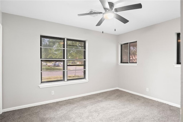 unfurnished room with ceiling fan and carpet flooring