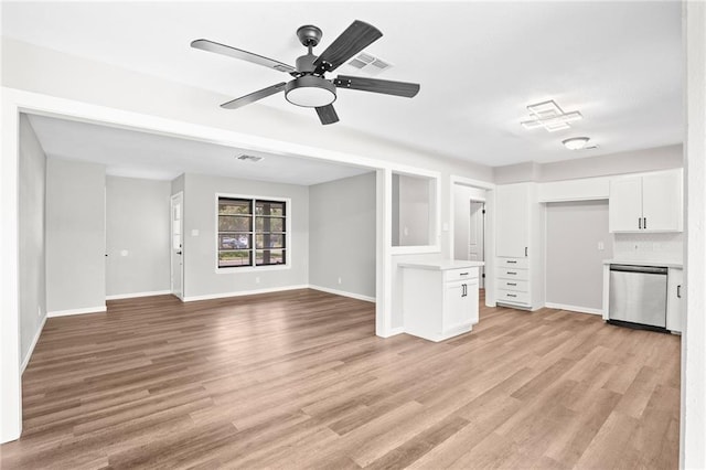 unfurnished living room featuring ceiling fan and light hardwood / wood-style floors