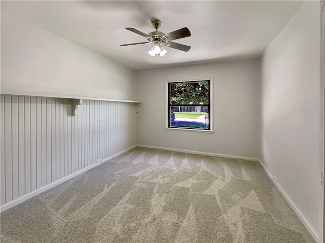 carpeted empty room with ceiling fan