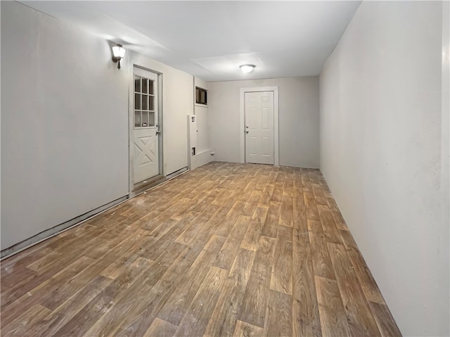 unfurnished room with light hardwood / wood-style floors