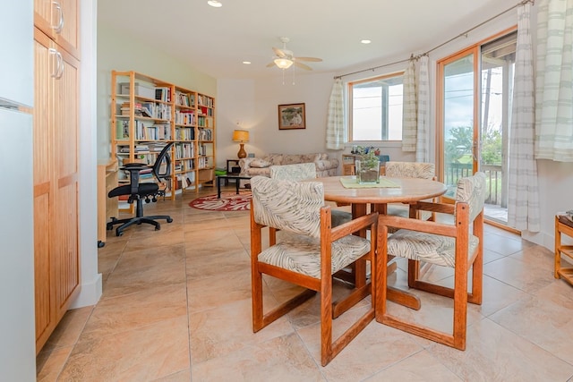 tiled dining room with ceiling fan