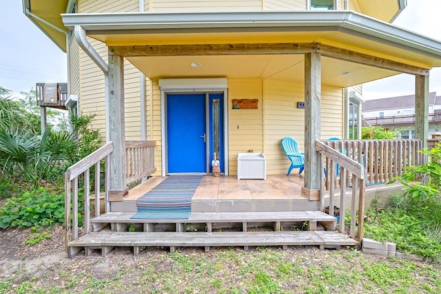 doorway to property featuring a porch